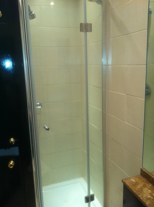 Frameless glass shower enclosure with chrome fittings in Lower Edmonton