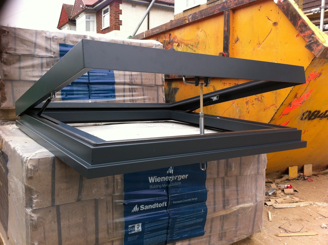 Opening flat roof skylight in anthracite grey installed in Lower Edmonton
